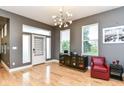Inviting living area boasts hardwood floors, modern lighting, and stylish decor, perfect for entertaining at 902 Woodlawn Ave, Indianapolis, IN 46203