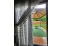 View of private backyard with a patio, green turf, privacy fence, and a fire pit at 9507 Colony Pointe E Dr, Indianapolis, IN 46250