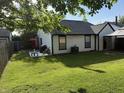 Well-maintained backyard with a green lawn, patio, and partial privacy fence at 9507 Colony Pointe E Dr, Indianapolis, IN 46250