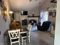 Cozy living room featuring neutral colors, fireplace, and ample natural light at 9507 Colony Pointe E Dr, Indianapolis, IN 46250