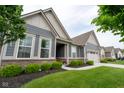 Charming single-story home with well-kept landscaping, featuring brick accents and a convenient two-car garage at 9741 Haughton Ln, McCordsville, IN 46055
