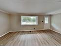 Inviting living room with light-filled window and durable wood-look flooring at 988 Westfield Rd, Noblesville, IN 46062