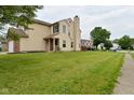 This house has a spacious backyard and a well maintained lawn at 10722 Mistflower Way, Indianapolis, IN 46235