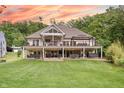 Expansive backyard view showcases a multi-level deck perfect for outdoor entertaining and relaxation at 11911 W Grandview Dr, Columbus, IN 47201
