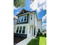 Beautiful two-story home with a mix of vinyl siding and stacked stone accents, plus a well-kept front yard at 17399 Dovehouse Ln, Westfield, IN 46074