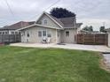 Spacious backyard featuring a well-maintained lawn and a concrete patio perfect for outdoor entertaining at 2208 S F St, Elwood, IN 46036