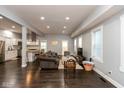 Spacious living room and kitchen combination, perfect for entertaining, and features dark hardwood floors and gray walls at 326 Parkway Ave, Indianapolis, IN 46225