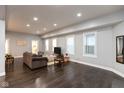 Bright and airy living room with recessed lighting, hardwood floors, and plenty of natural light from multiple windows at 326 Parkway Ave, Indianapolis, IN 46225