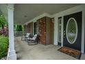 Covered porch with rocking chairs offering a relaxing outdoor space at 4013 Hillendale Dr, Greenwood, IN 46142