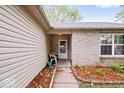 Inviting front porch with seating area and well-kept garden bed leading to the front door at 4016 Dogwood Ln, Franklin, IN 46131