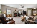Cozy living room featuring neutral paint, plush carpet, with ample seating perfect for relaxation and entertainment at 5576 W Glenview Dr, McCordsville, IN 46055