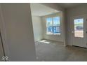 A well-lit space featuring a window and a door, ideal for customization into an office or den at 6450 Stone Side Dr, Plainfield, IN 46168