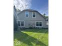 Home exterior featuring a lush green lawn and neutral colored siding at 7548 Briarstone Dr, Indianapolis, IN 46227