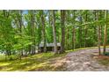 This cozy cabin retreat, nestled among towering trees, offers a peaceful escape into nature at 8434 S Christian Dr, Nineveh, IN 46164