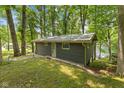 Secluded cabin on a verdant lot, boasting easy access to the water for serene lakeside living at 8434 S Christian Dr, Nineveh, IN 46164