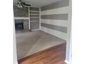Cozy living room with a fireplace, built-in shelves, and neutral carpet, perfect for relaxation at 922 Eagle Brook Dr, Shelbyville, IN 46176