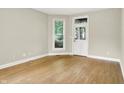 Bright living room with hardwood floors, neutral paint, and ample natural light at 925 Fayette St, Indianapolis, IN 46202