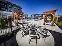 Cozy fire pit with Adirondack chairs in a luxury apartment community outdoor lounge area at 9741 Oleander Dr, Fishers, IN 46250