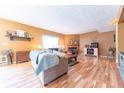 Comfortable living room showcasing hardwood floors and inviting fireplace at 977 Canary Creek Dr, Franklin, IN 46131