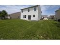 Expansive backyard with lush green grass, offering ample space for outdoor activities and relaxation at 10431 Bellchime Ct, Indianapolis, IN 46235