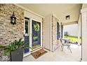 Close-up of the front porch with a welcome mat and decorative wreath at 1222 Grand Canyon Ct, Franklin, IN 46131