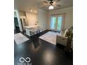 Spacious living room boasts dark wood floors, an open layout, and natural light at 12853 Tradd St # 2B, Carmel, IN 46032