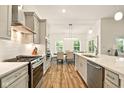 Bright, open-concept kitchen with modern appliances, spacious countertops, and seamless flow to the dining area at 19257 Red Willow Ln, Noblesville, IN 46062