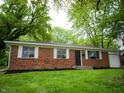 Inviting brick home featuring a well-maintained lawn and cozy front entrance at 21 Roderick Ct, Beech Grove, IN 46107