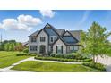 Well-maintained two-story home with a spacious lawn, offering curb appeal at 2485 Alexandra Dr, Carmel, IN 46074