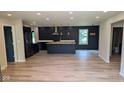 Beautiful open kitchen with hardwood floors, an island and stainless steel appliances at 258 Riverwood Dr, Noblesville, IN 46062