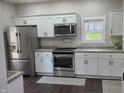 Bright kitchen with stainless steel appliances, white cabinets, and granite countertops at 4303 W County Road 200 S Rd, Danville, IN 46122