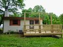 Cozy home with an inviting wood deck, perfect for relaxing and enjoying the outdoors at 4675 N Herbemont Rd, Martinsville, IN 46151