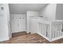 Bright foyer with wood floors, white walls and banister, and double doors at 5097 Vantage Point Rd # B 2, Avon, IN 46123