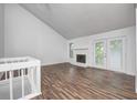 Spacious living room with vaulted ceiling, fireplace, and wood floors at 5097 Vantage Point Rd # B 2, Avon, IN 46123