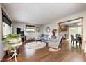 Comfortable living room with hardwood floors, a cozy seating area, and access to the kitchen at 5739 Paradise Dr, Martinsville, IN 46151