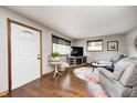Bright living room featuring hardwood floors, a comfortable seating area, and natural light from the windows at 5739 Paradise Dr, Martinsville, IN 46151