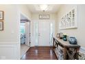 Bright foyer with stylish décor and hardwood flooring welcomes guests at 6337 Ederline Ln, Noblesville, IN 46062
