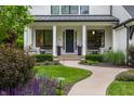Inviting front porch with chairs, potted plants, and a well-maintained walkway at 6450 Holliday E Dr, Indianapolis, IN 46260