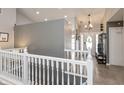 Bright foyer with hardwood floors and a view of the staircase and entry at 8084 Lawrence Woods Pl, Indianapolis, IN 46236