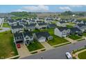 Expansive aerial view of a residential community with well-maintained lawns and modern homes at 9829 Hulton Rd, Pendleton, IN 46064
