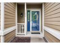 Up close view of front door featuring storm door, welcome mat, and a wreath at 11040 Brave Ct, Indianapolis, IN 46236