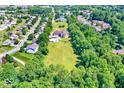 Beautiful home with a pool and treelined backyard offering lots of privacy and space at 11575 Freeport Dr, Carmel, IN 46032
