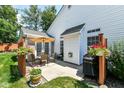 Outdoor patio featuring a dining set and grill for entertaining, all surrounded by green lawn at 11692 Seven Oaks Dr, Fishers, IN 46038