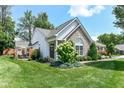 Attractive home boasting a stone facade, lush lawn, and inviting curb appeal at 11692 Seven Oaks Dr, Fishers, IN 46038