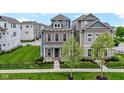 Attractive two-story home featuring a brick facade, siding, and a well-maintained front yard at 13048 Minden Dr, Fishers, IN 46037