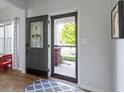 Light and airy entryway featuring a decorative front door and a view of the landscaped front yard at 13485 Mancroft Dr, Fishers, IN 46037