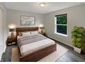Cozy bedroom with a comfortable bed, soft lighting, and minimalist decor at 15110 Fawn Hollow Ln, Noblesville, IN 46060