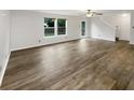 Spacious living room featuring hardwood floors, natural light and neutral color palette at 15110 Fawn Hollow Ln, Noblesville, IN 46060