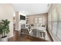 Cozy living room with a fireplace, comfortable seating, and plenty of natural light at 15421 Bowie Dr, Westfield, IN 46074