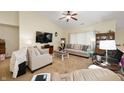 Spacious living room boasting a vaulted ceiling, carpet flooring, and a large television for entertainment at 18913 Course View Rd, Noblesville, IN 46060